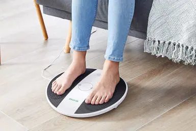 Close up of womans feet on a prohealth device 