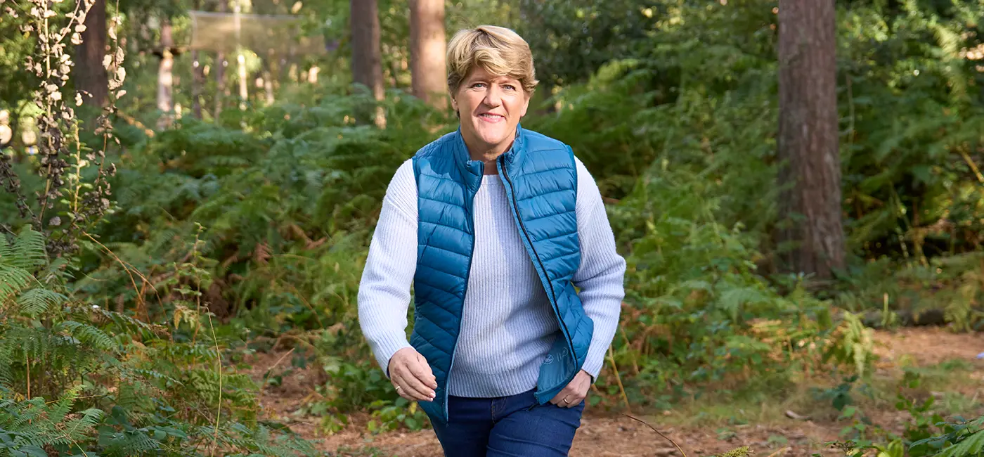 Clare Balding walking outdoors with a smile - showcasing leg health and mobility