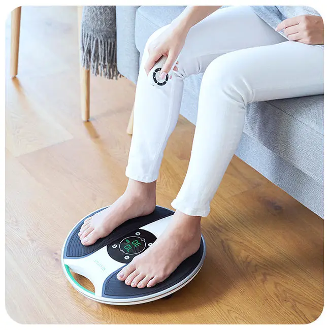 Woman with her feet on a medic device